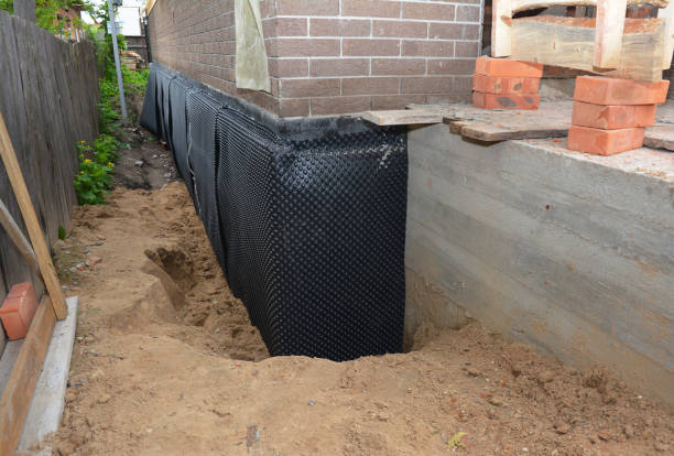 Happy homeowners after waterproofing job in Muir